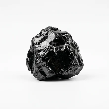 Glossy black mineral rock, the natural source of fulvic acid